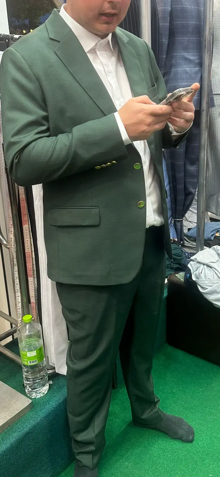 Client in an olive-green tailored suit